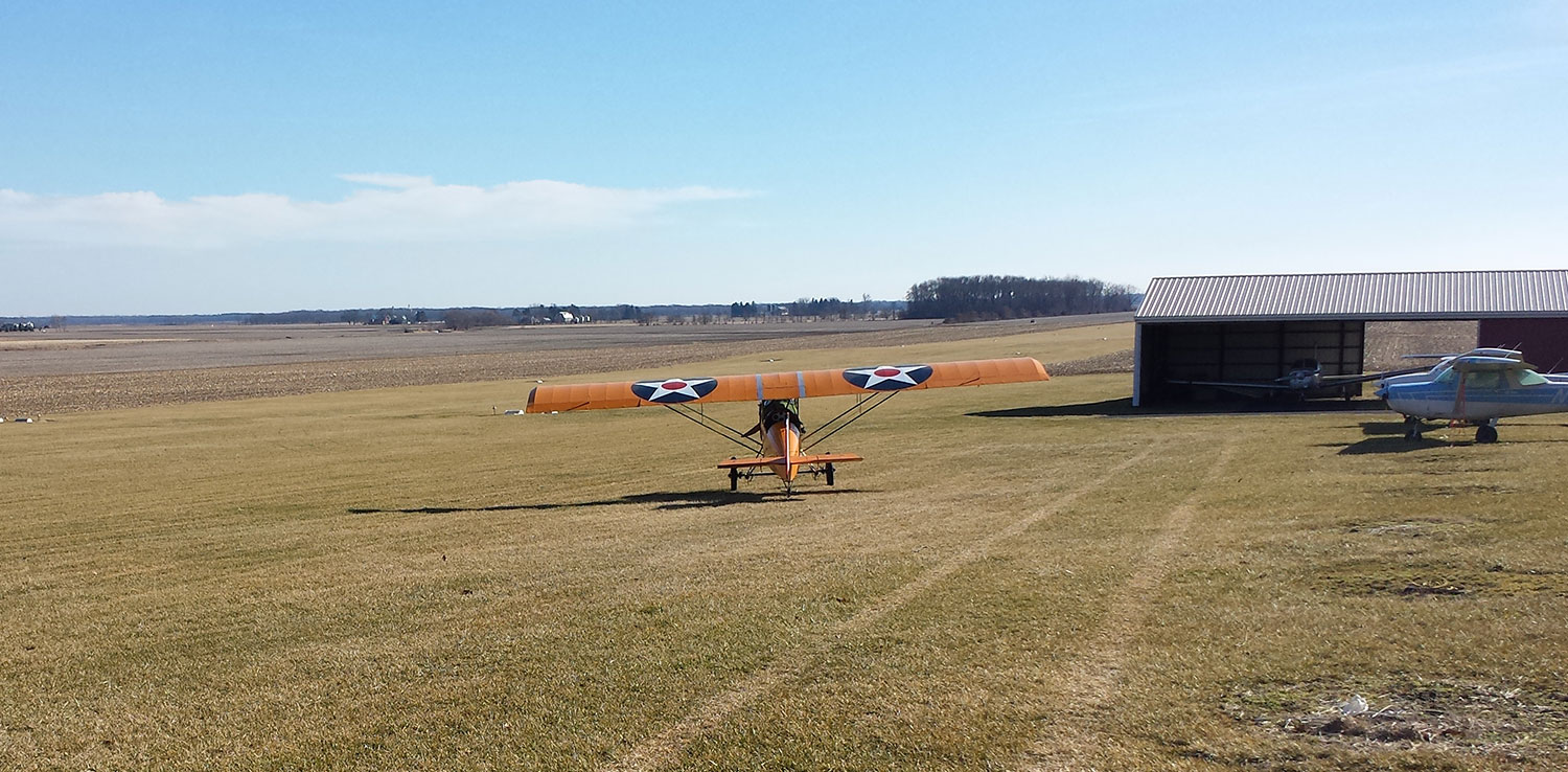 This photo was taken the end of February at a grass strip in Lowell IN. It was about 1/2 way into a 2.5 hr flight. Pretty lonely scene with no one around, even at the office. Back at my home airport , Porter Co. Regional, it was so busy it had to have the radio on and really watch the traffic.